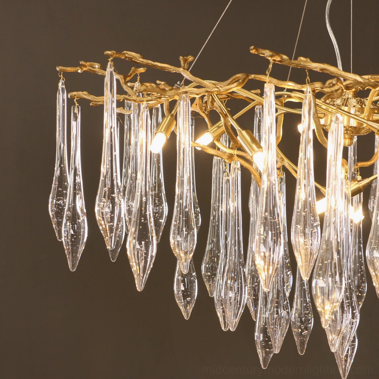 Branch-style crystal chandelier left side view showing twig-shaped metal frame and hanging glass pendants