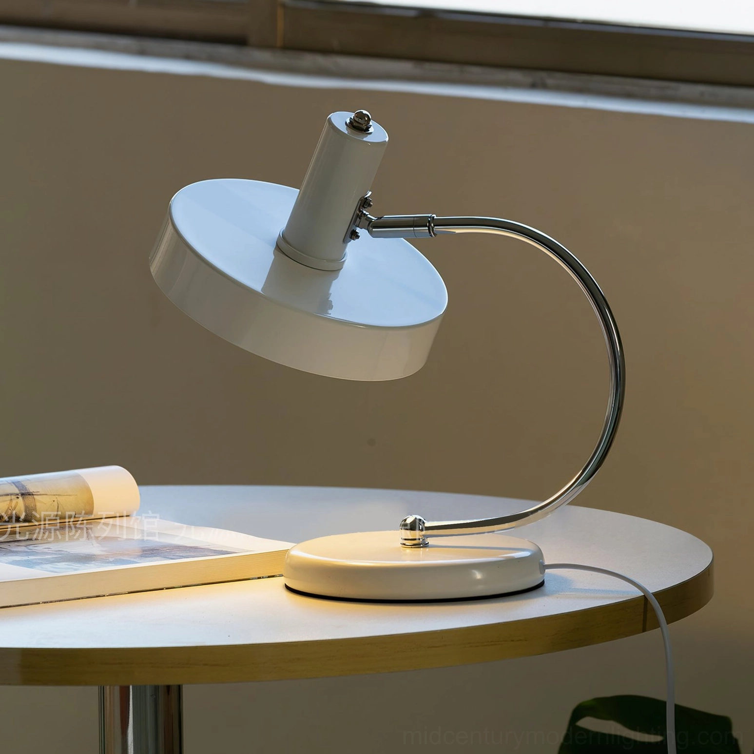 Brano minimalist lamp by window on wooden table with magazine, natural daylight styling
