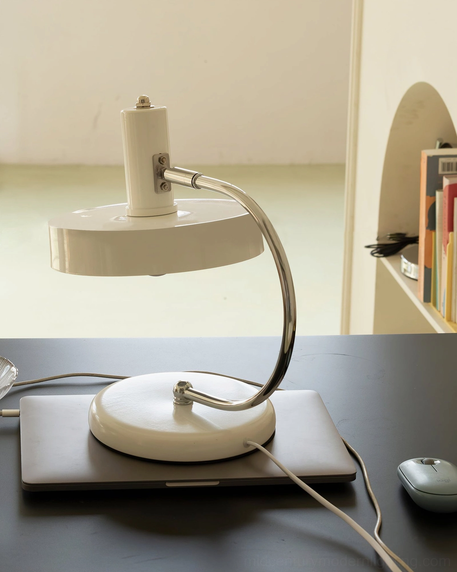 White Brano table lamp in minimalist niche shelf with books, Scandinavian interior design