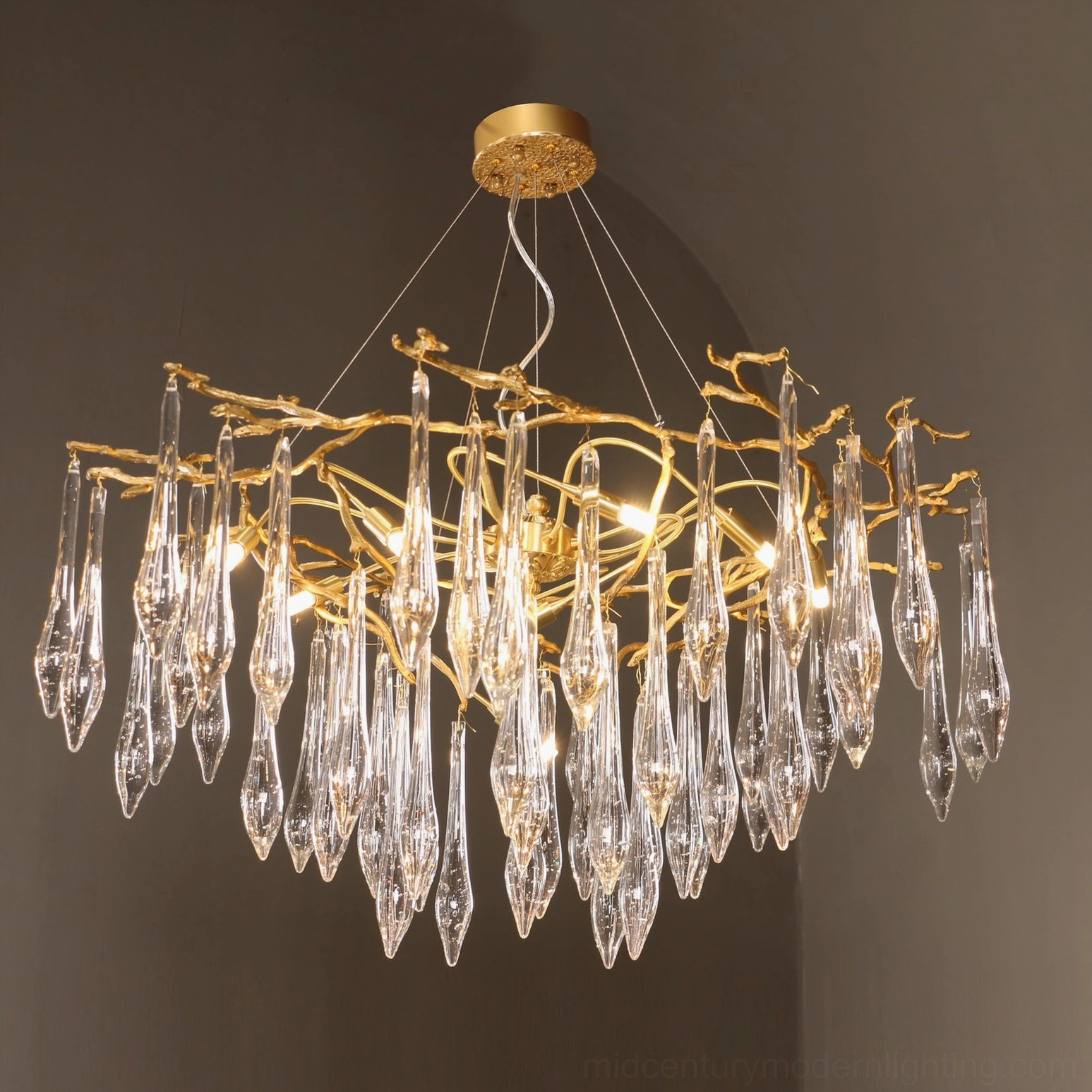 Brass branch chandelier detail showing individual pendant mounting and frame structure