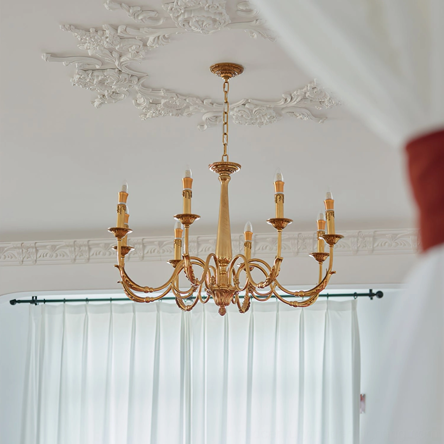 Full brass candle chandelier with 8-light arm structure and vintage gold finish mounted from below