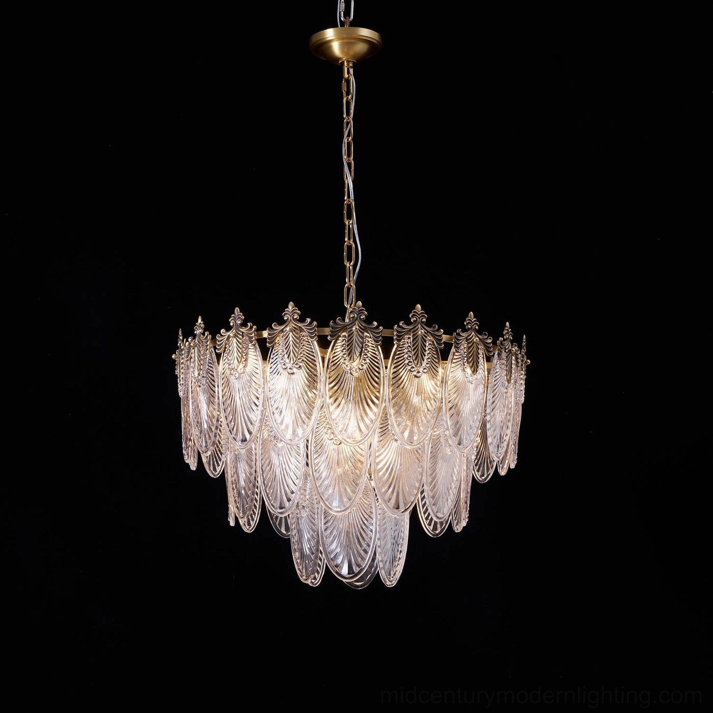 Brass leaves chandelier installed in modern eclectic interior space, showing warm ambient lighting and sculptural brass form