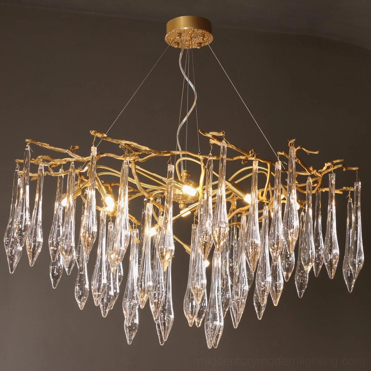 Brass chandelier with multiple hanging glass pendants showing complete architectural composition