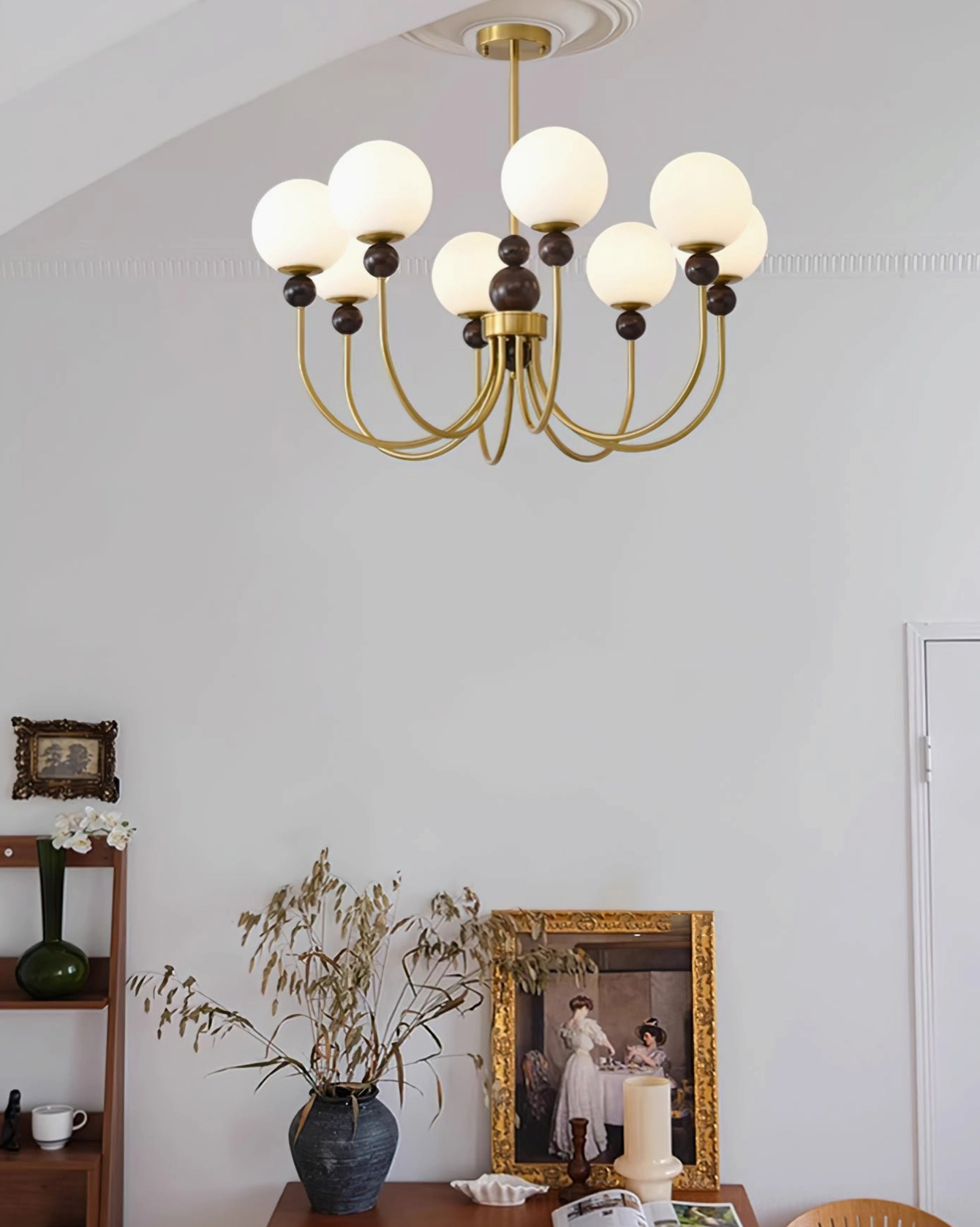 Modern glass chandelier with brass frame overhead view in retro display living room with vintage shelf