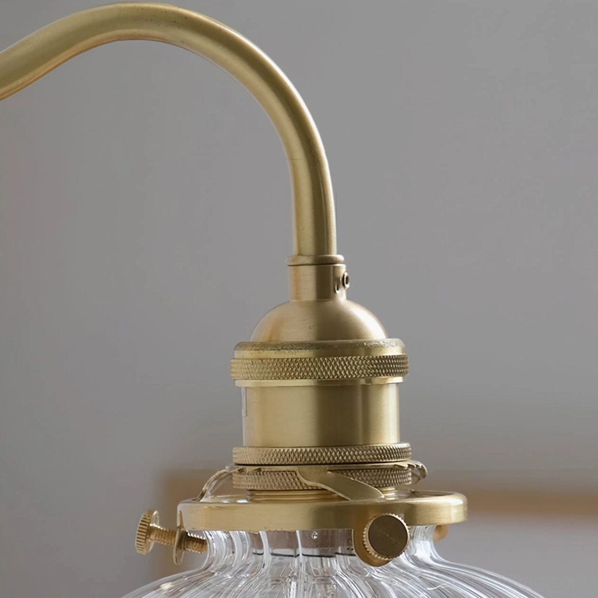 Brass hardware and knurled brass details of vintage wall sconce fixture - industrial mid-century craftsmanship