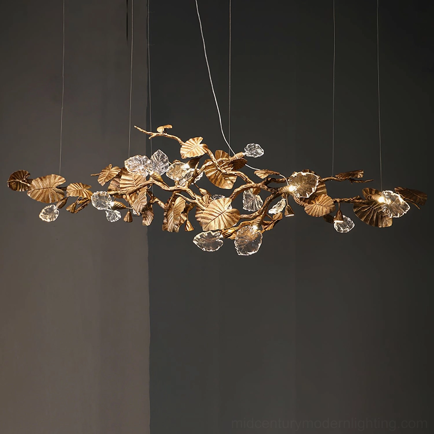 Brass leaf chandelier botanical design - nature-inspired glass leaves in polished gold metal framework