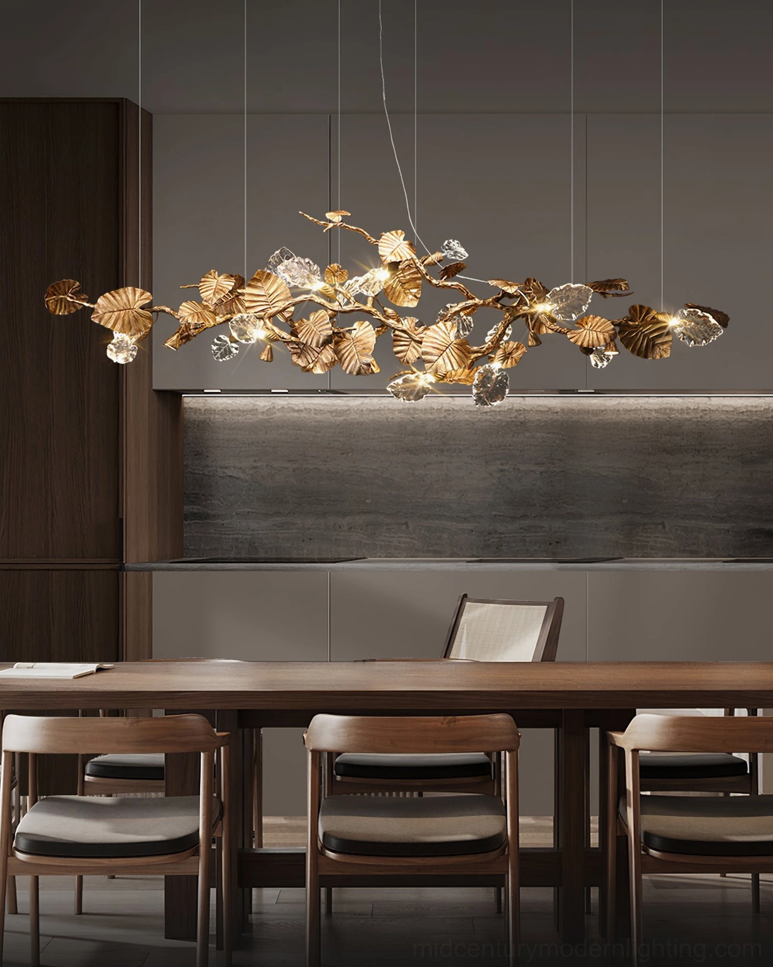 Brass leaf chandelier complete view - full linear pendant arrangement showing all illuminated glass leaves