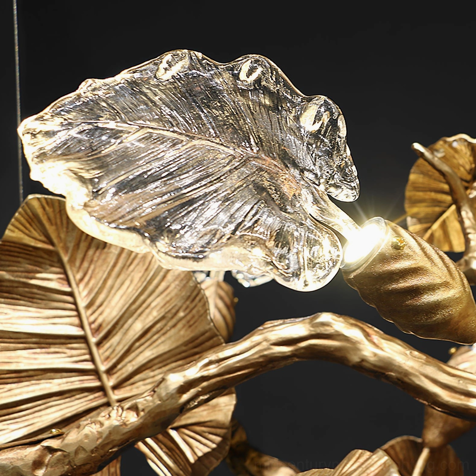 Illuminated glass leaf fixture detail - textured clear glass leaf with integrated LED light and vein pattern