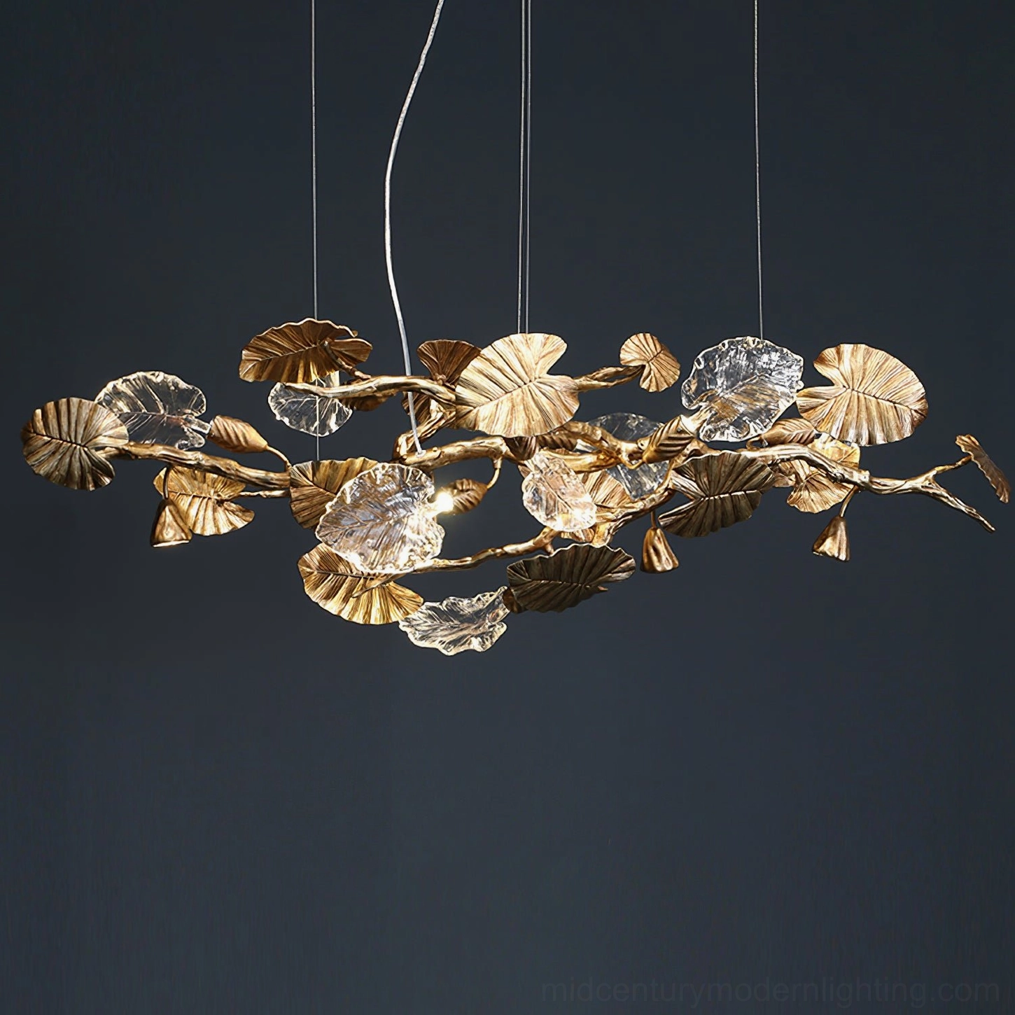 Brass leaf chandelier modern aesthetic - minimalist linear pendant with organic glass leaf details