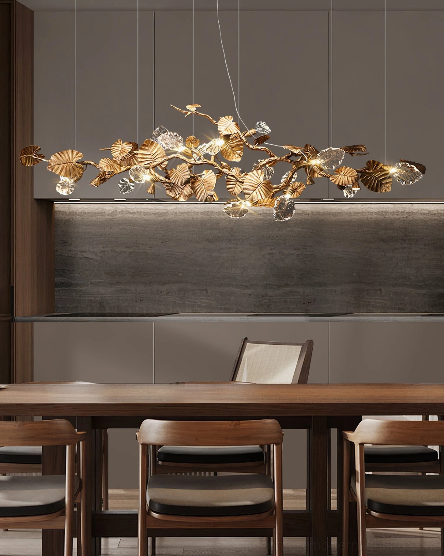 Linear brass leaf chandelier in modern dining space - minimalist interior with warm ambient luxury lighting