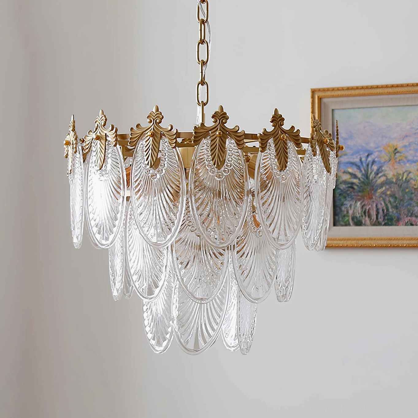 Unlit brass leaves chandelier showing polished brass finish, clear articulation of three tiered rings with ornamental acanthus metal details