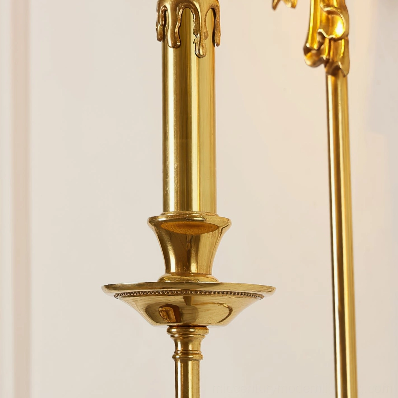 Side profile of brass wall lamp arm and candle tray with beaded edge detail