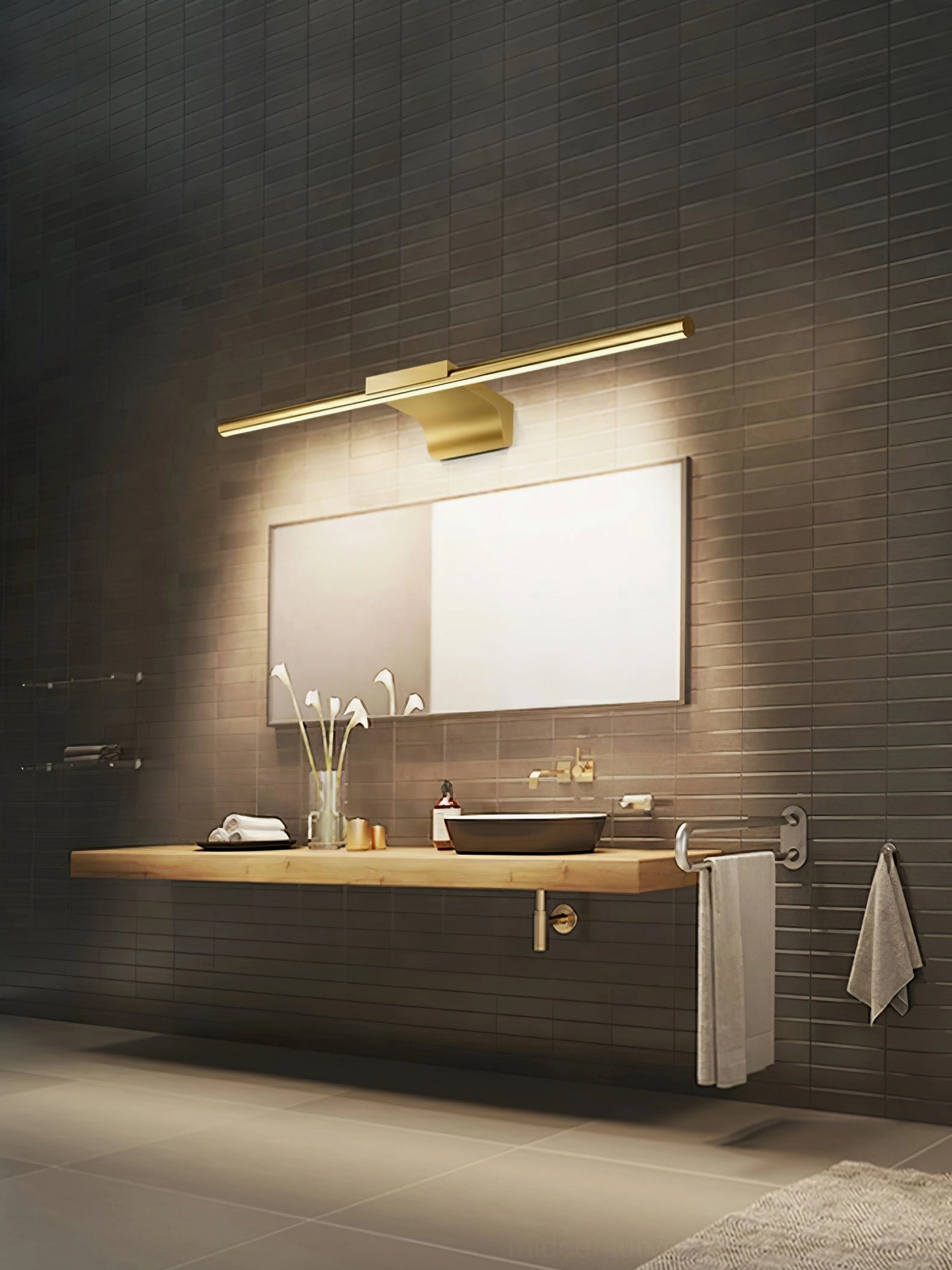 Dark tile bathroom with brass wall lamp providing warm ambient lighting