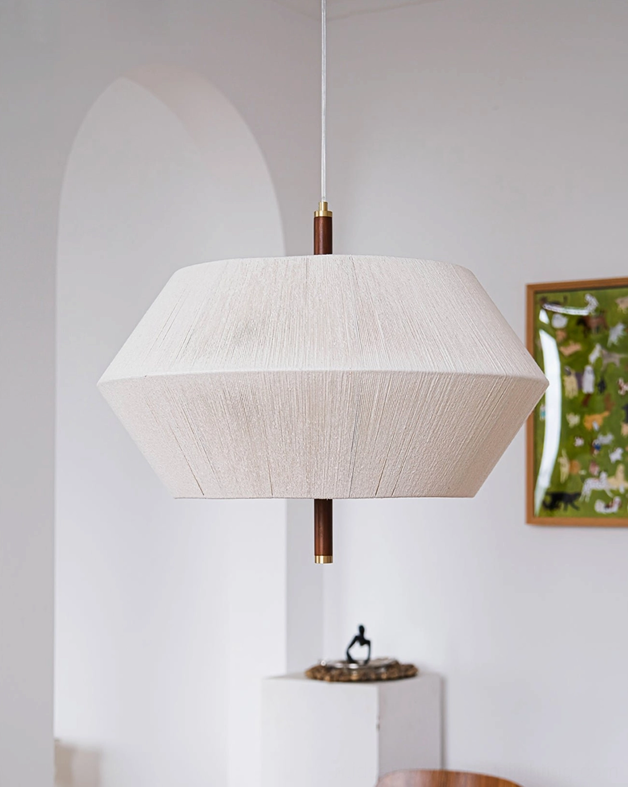Brera hemp pendant lamp in contemporary interior corner with minimalist wall art and neutral tones