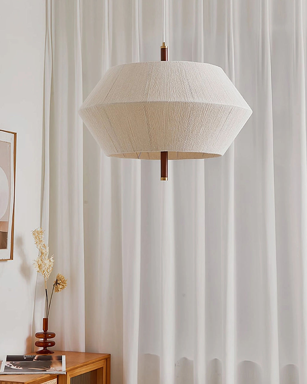 Side view of Brera pendant light showing neutral beige fabric shade with wooden hardware and metal fixtures