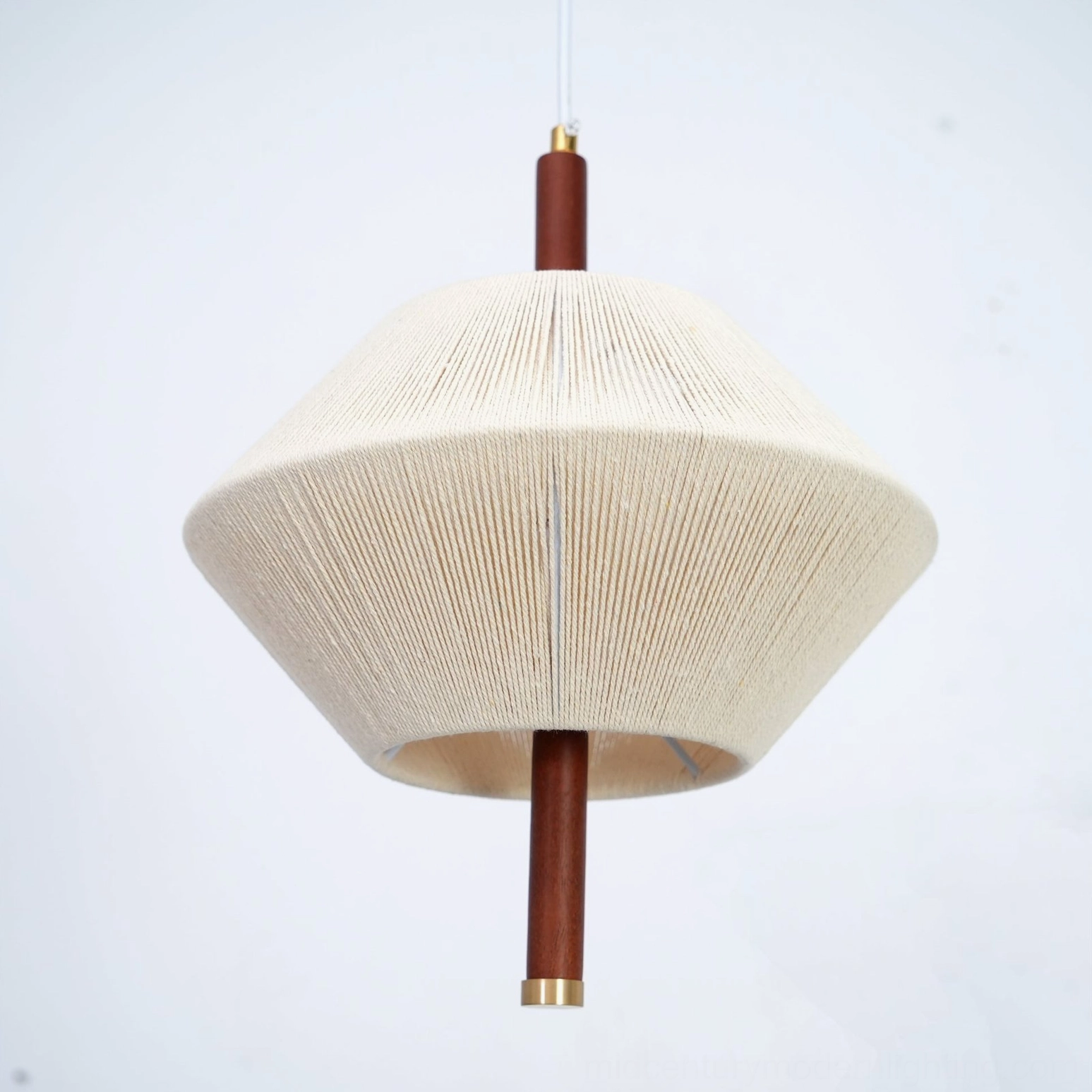 Brera hemp rope pendant light with walnut wood accent in minimalist interior space