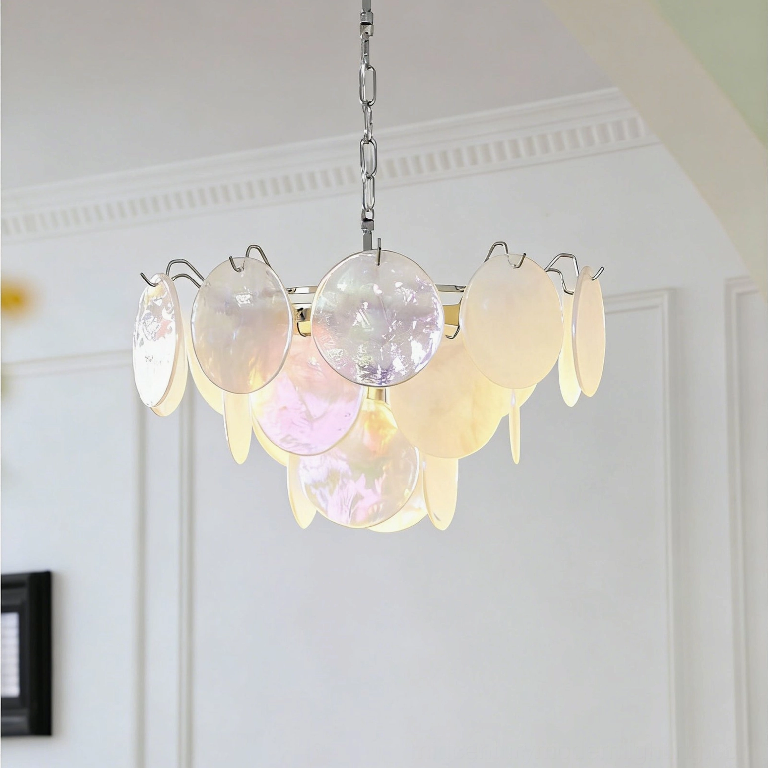 Brette waterfall glass chandelier in minimalist white interior space showcasing warm beige and pink glass disc gradients