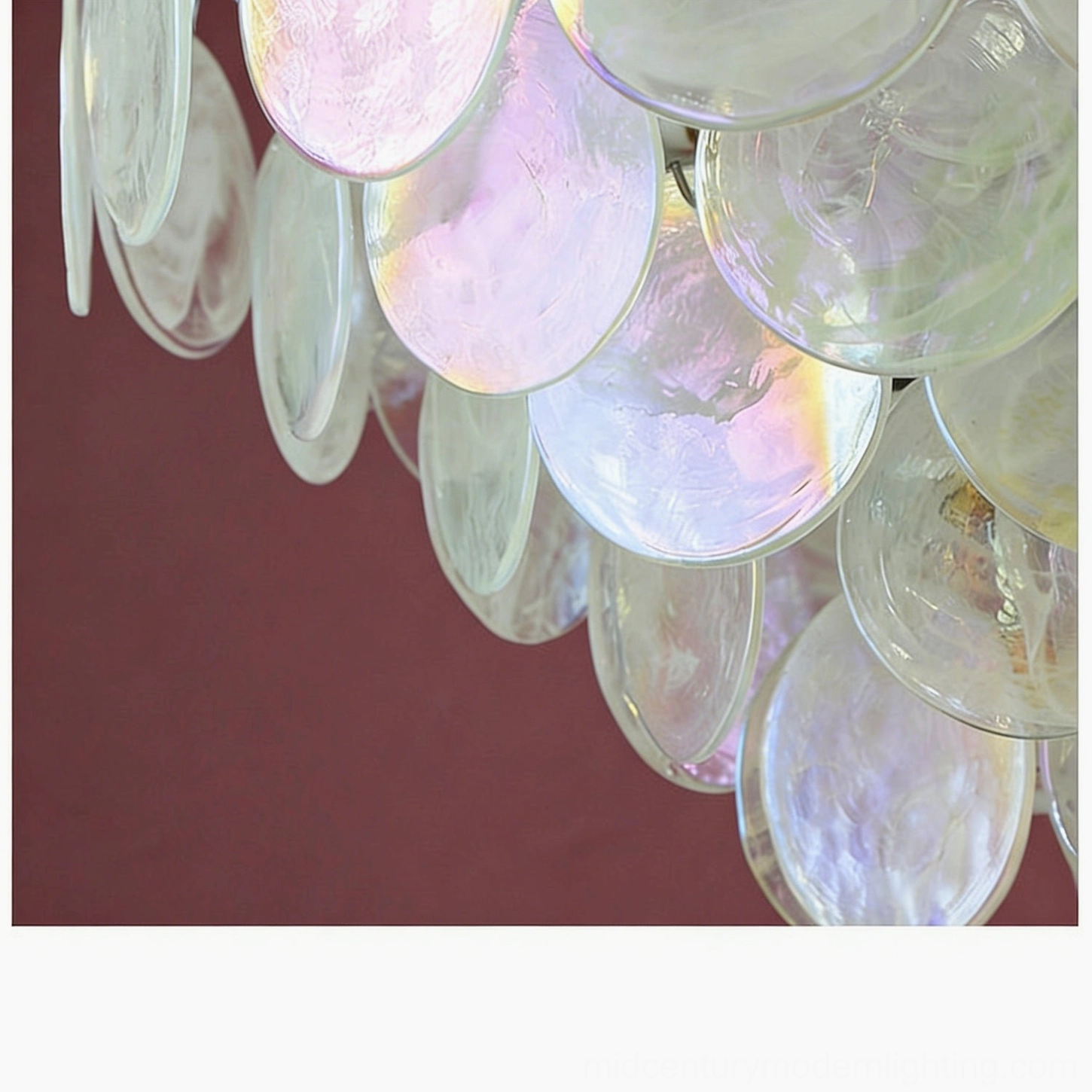 Brette disk glass chandelier pastel iridescent discs overhead view white studio background romantic vintage design