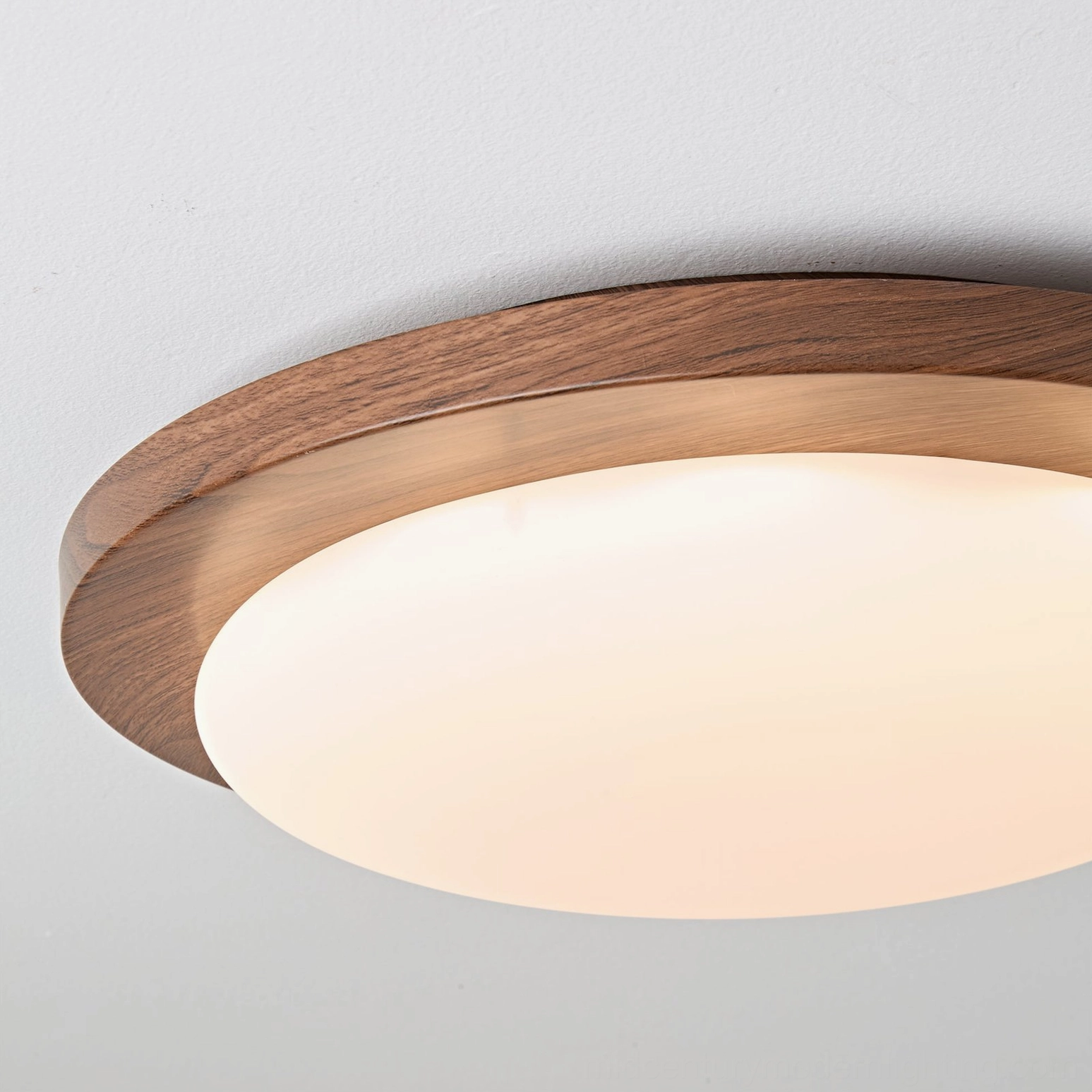 Bromo flush mount light in dining room setting, providing soft diffused illumination for entertaining