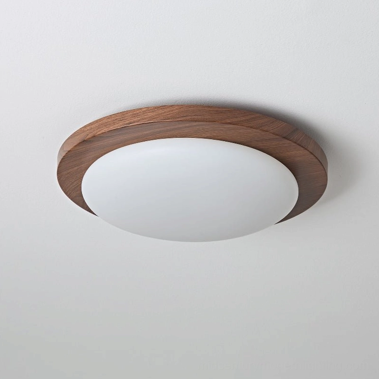Side profile view of Bromo walnut wood-rimmed ceiling light with frosted glass shade on white background