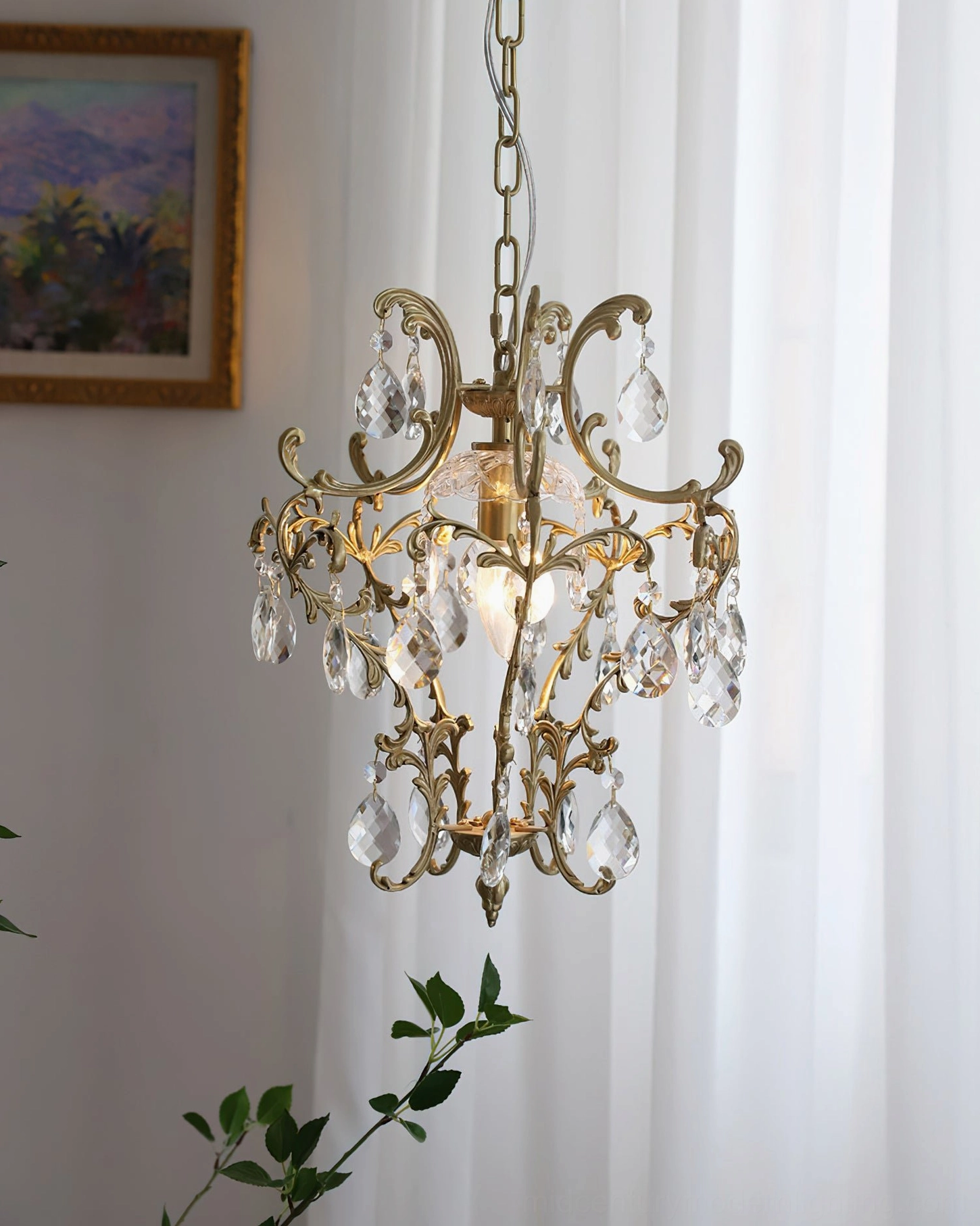 Bronze vintage-style birdcage crystal pendant with French country aesthetic in elegant bedroom space with sheer curtains