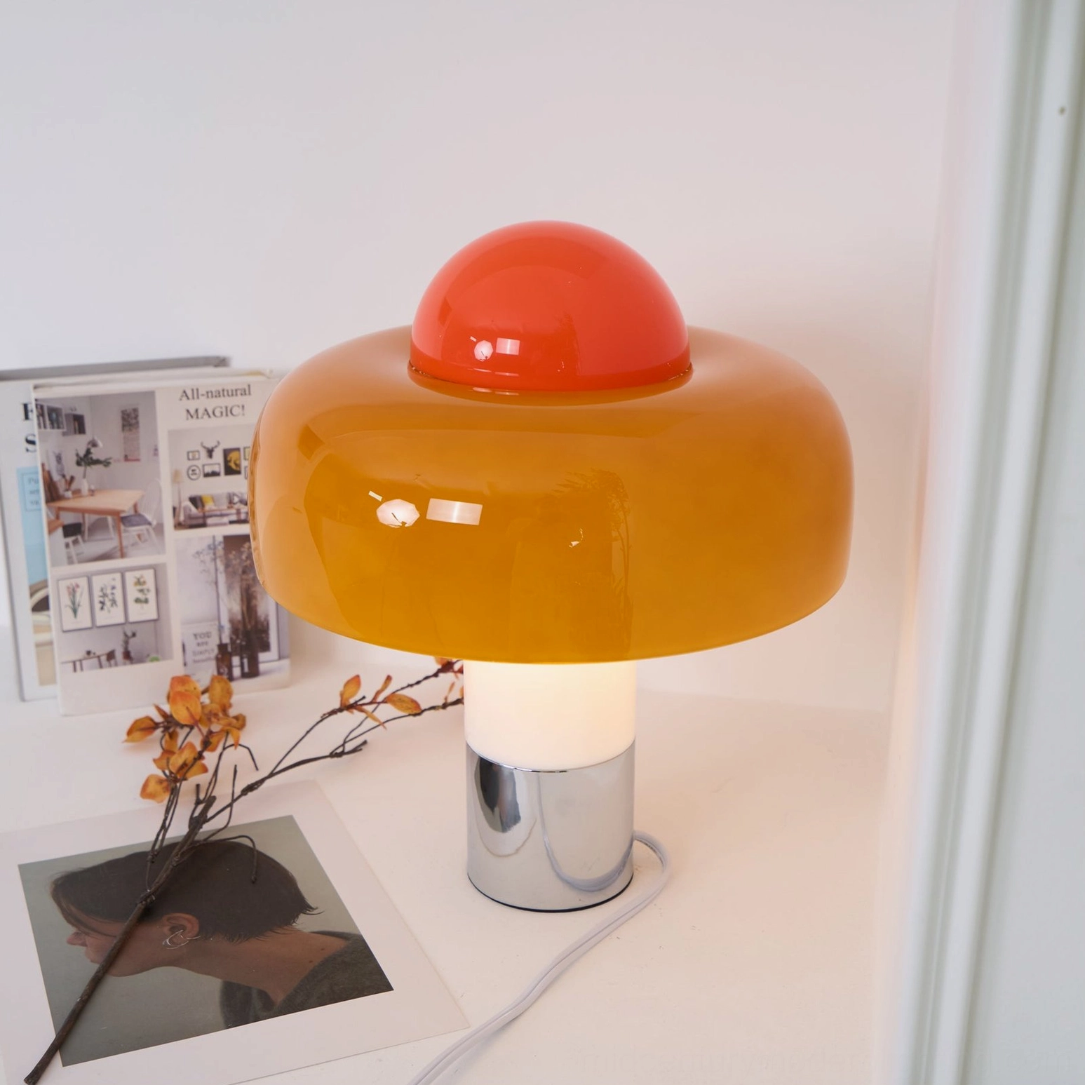 Brumbry mid-century modern table lamp in warm home setting, demonstrating ambient lighting capability