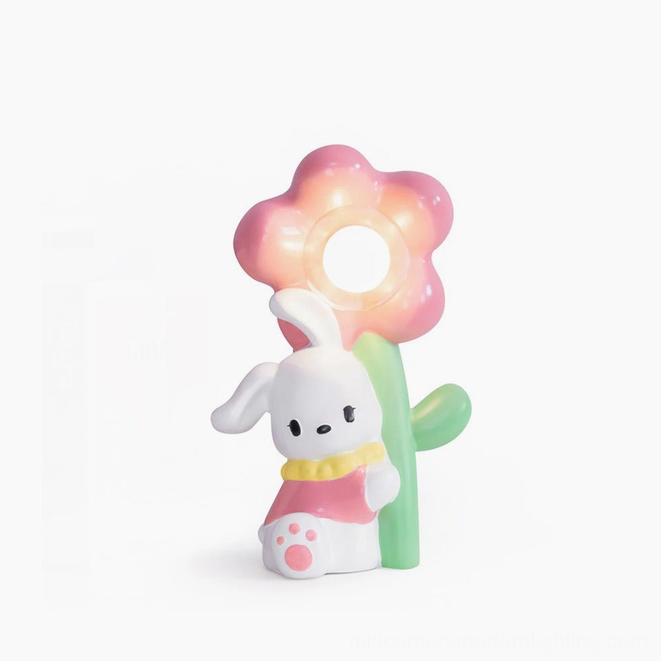 Whimsical Bunny Flower Table Lamp front view with pastel pink and green ceramic design on white background
