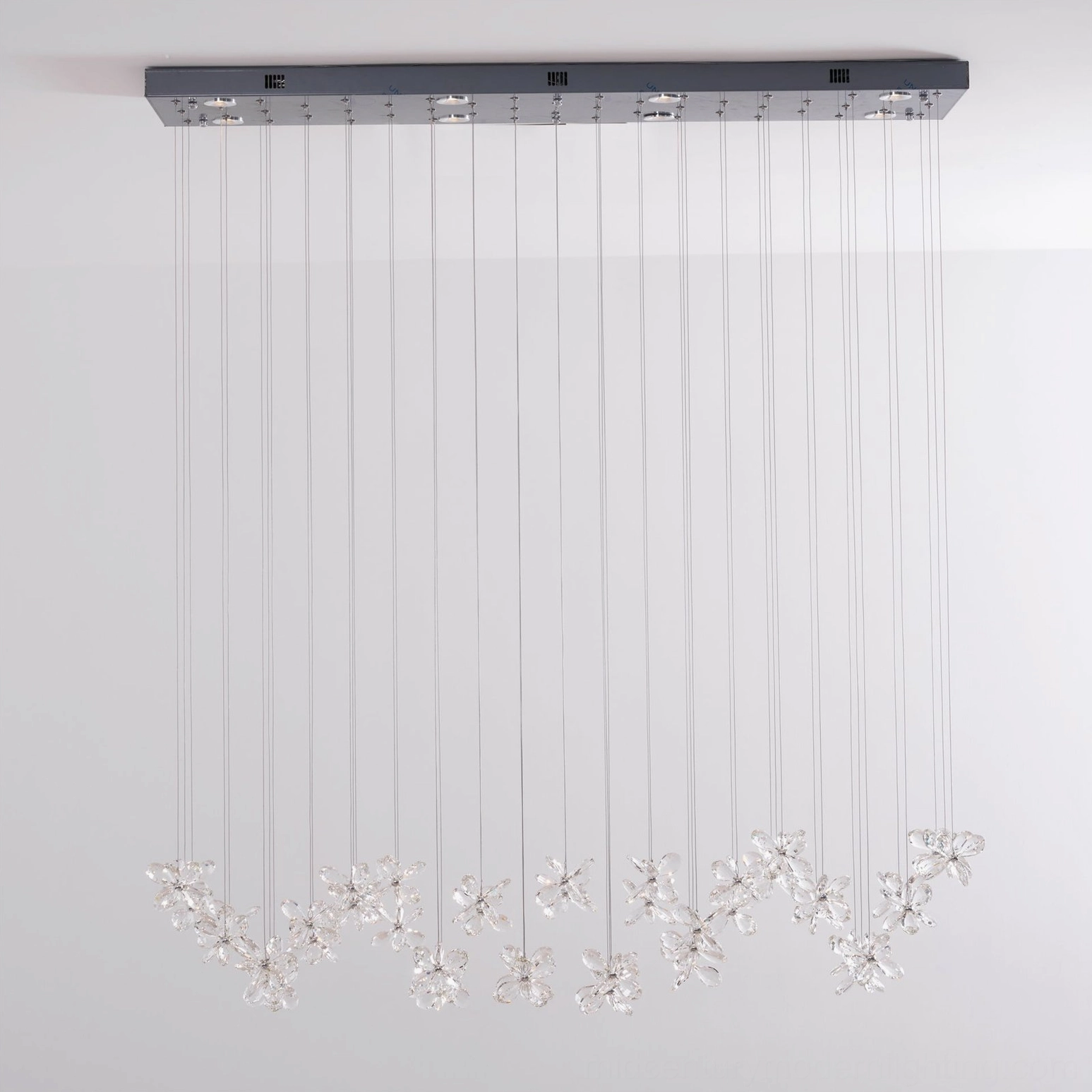 Crystal butterfly chandelier full product shot, modern pendant fixture with silver canopy, multiple adjustable crystal flower pendants, complete lighting design