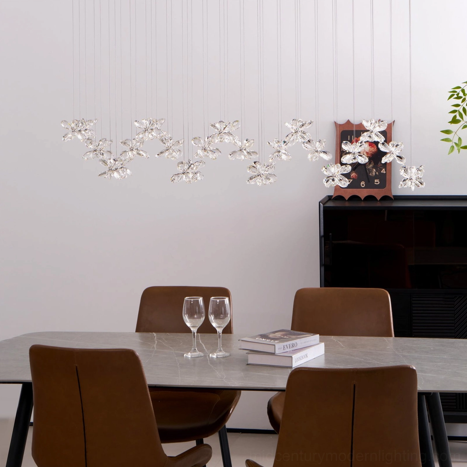 Crystal butterfly chandelier light distribution detail, faceted crystal petals with LED warm light reflection, ambient lighting ambiance demonstration