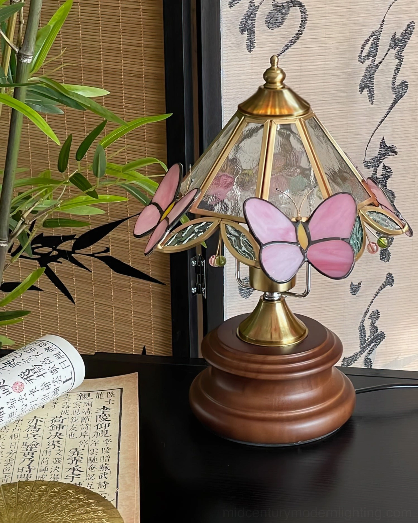Butterfly table lamp ambient lighting effect in bedroom setting with soft pink glow and romantic atmosphere