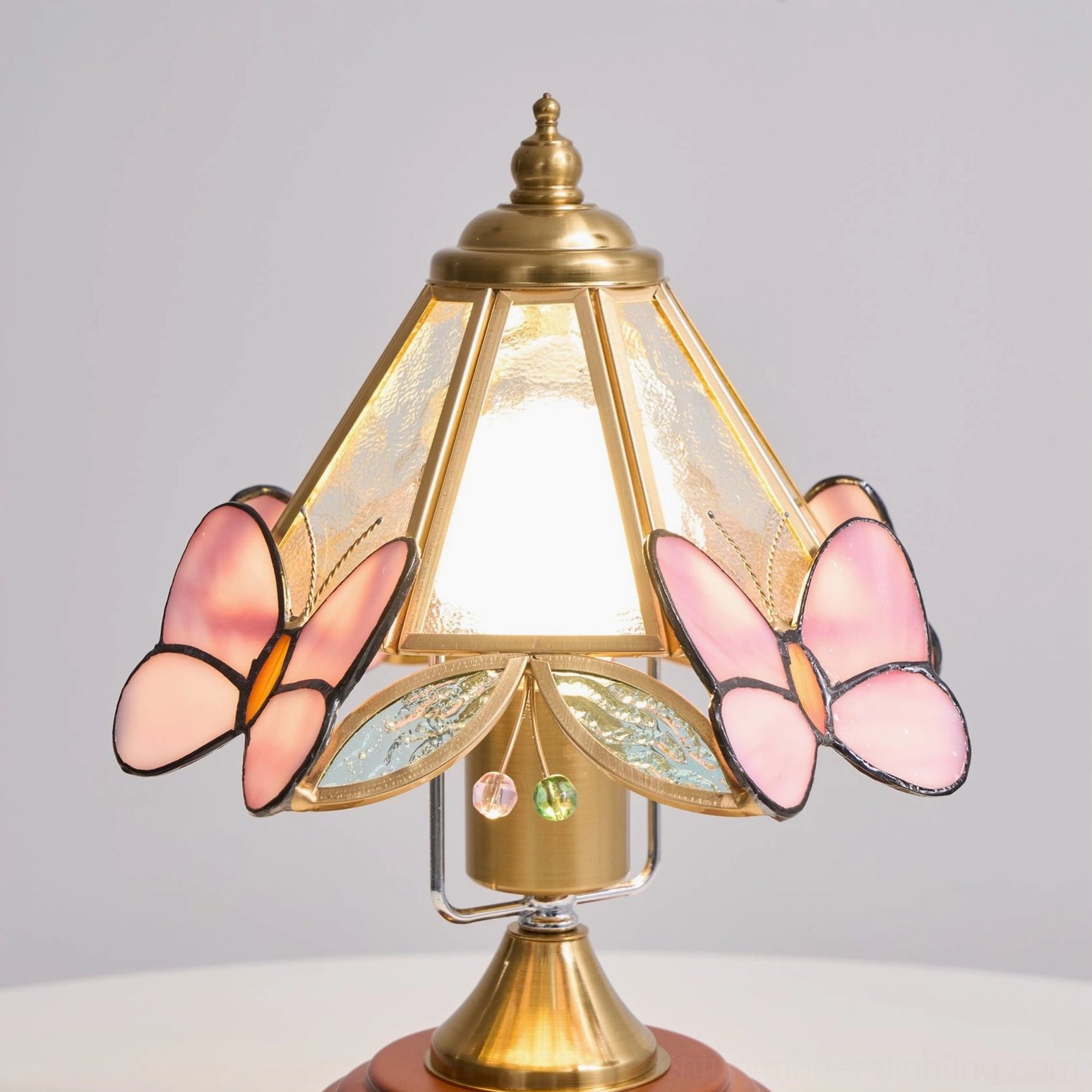 Butterfly stained glass lamp lighting fixture detail showing glass craftsmanship and butterfly motif design