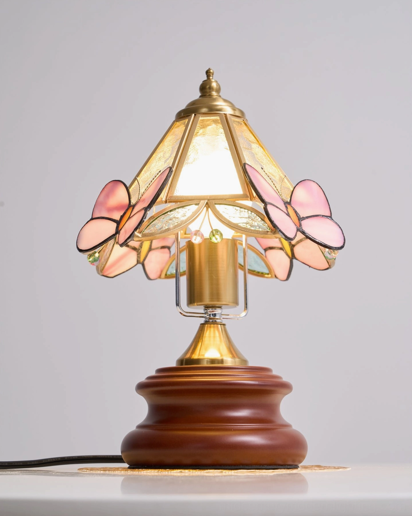 Jenny Butterfly lamp in vintage-inspired room setting with botanical decor and mid-century furnishings