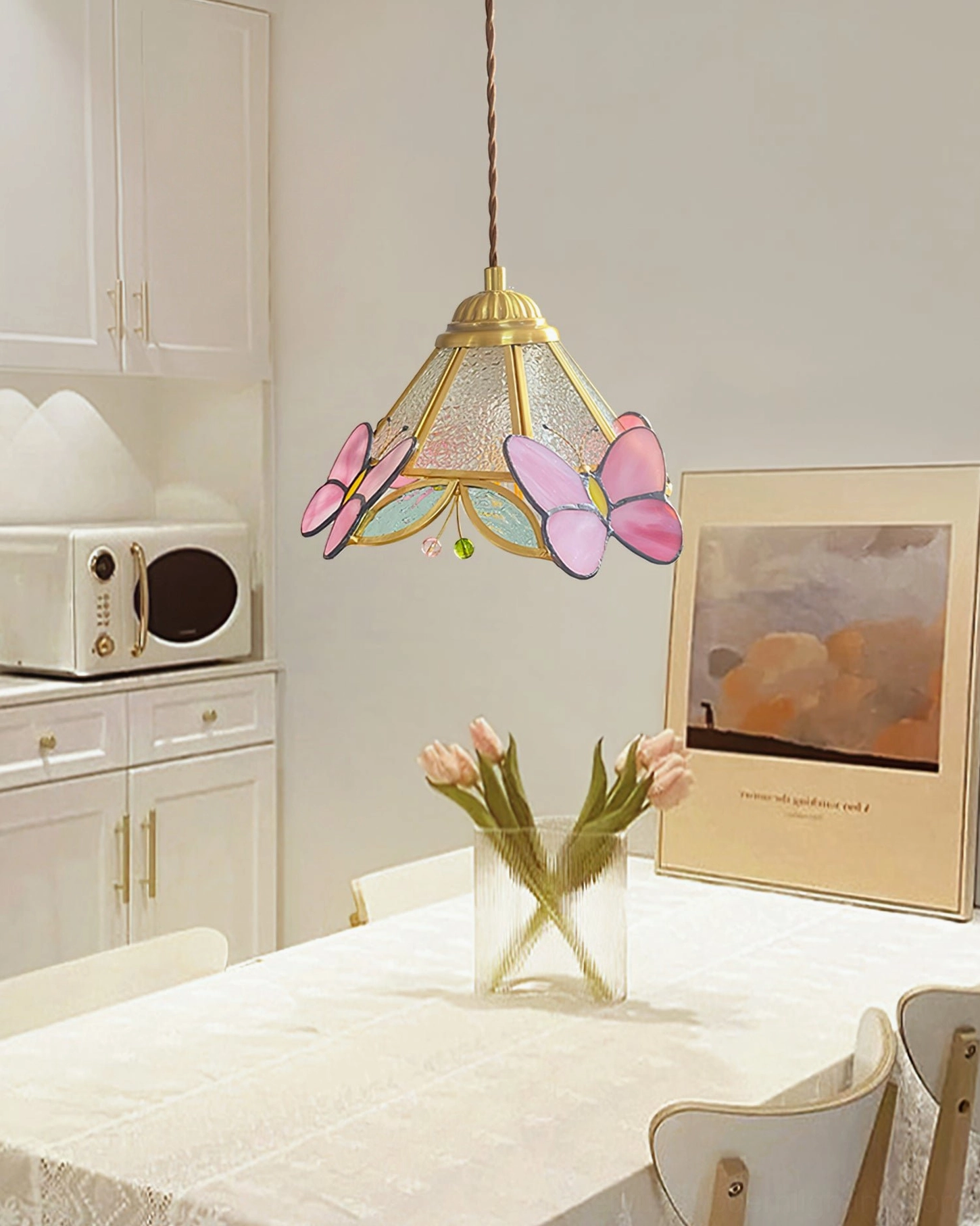 Lulla Butterfly Pendant Light Above Dining Table in Modern Kitchen with Floral Decor