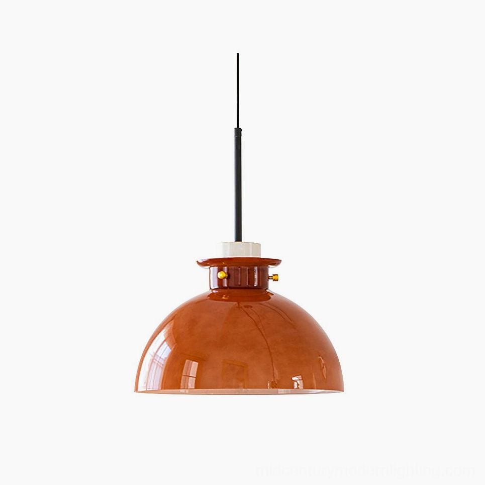 Cabras mid-century pendant light with caramel glass dome and brushed gold brass hardware, studio front view on white background