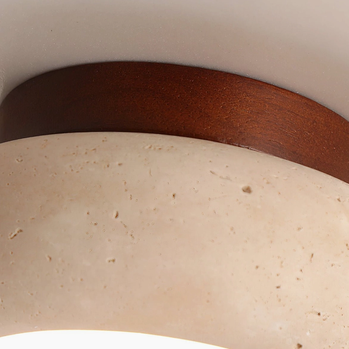 Cairns flush mount ceiling light in spa-like bathroom with travertine stone aesthetic