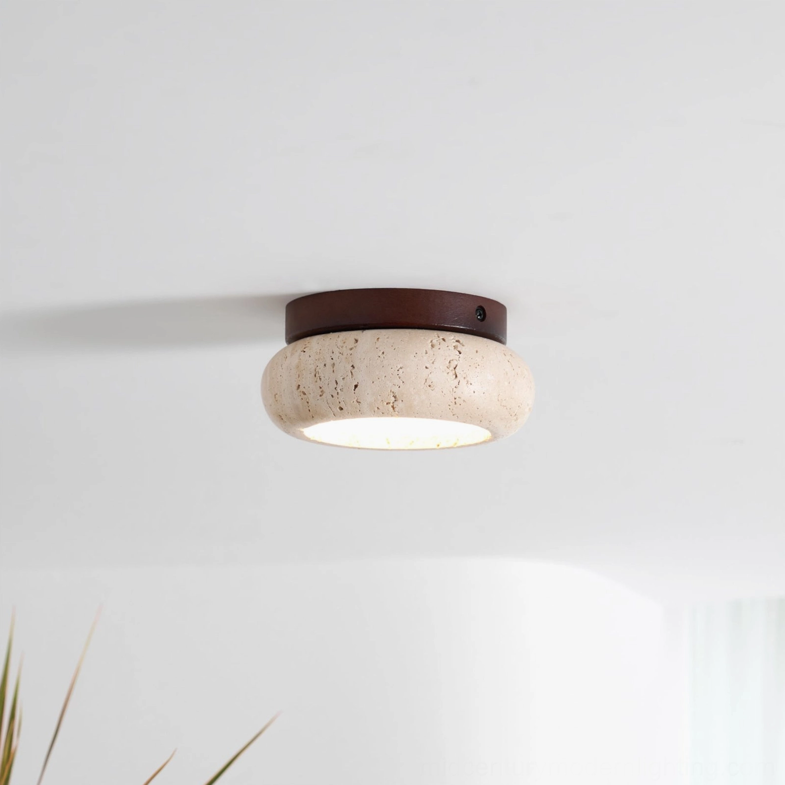 Cairns warm light travertine stone ceiling fixture integrated LED technology closeup
