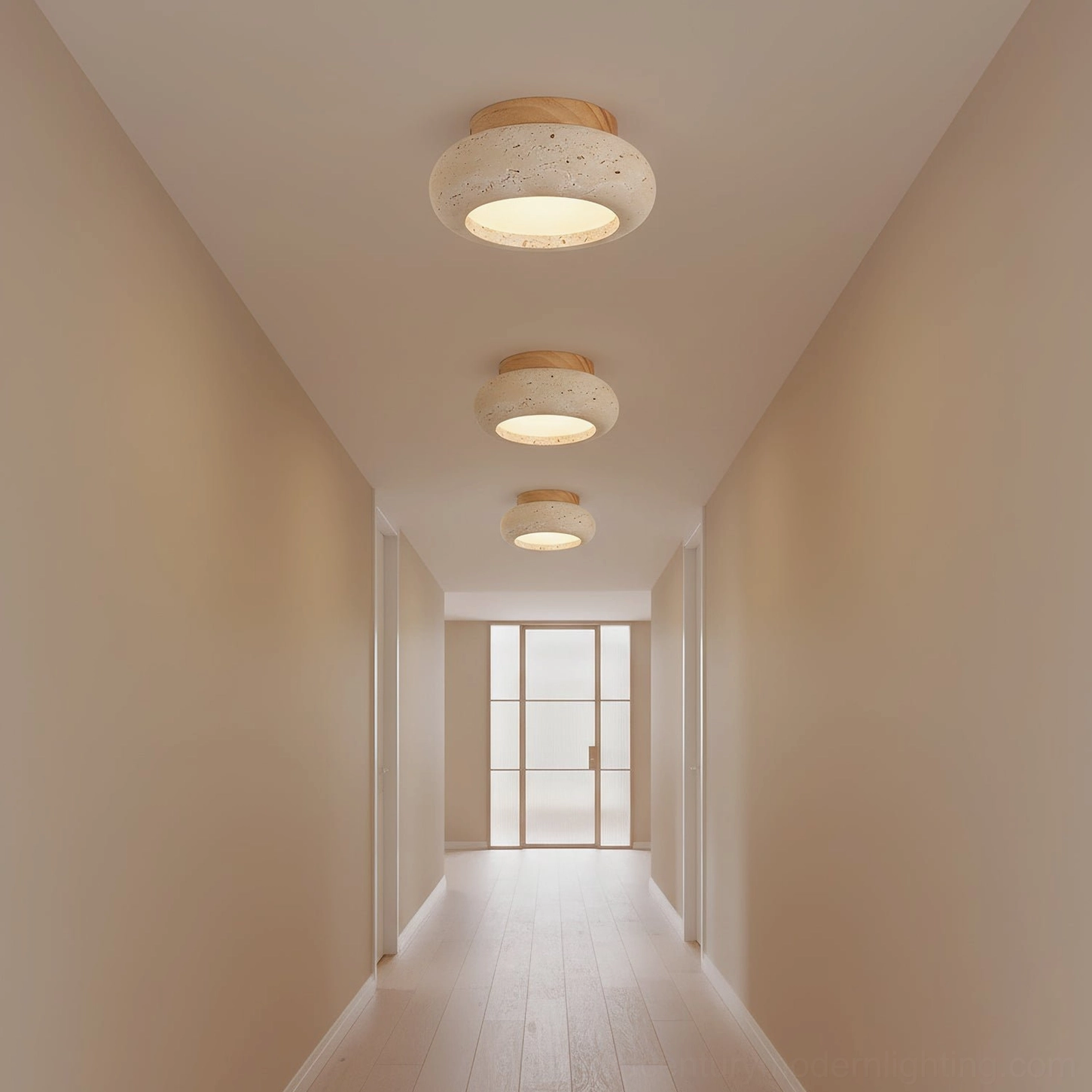 Cairns compact flush mount ceiling light in narrow wood-floored hallway with soft warm glow