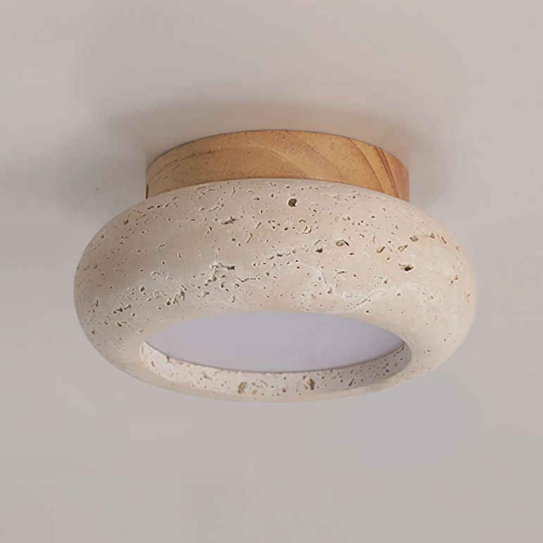 Cairns travertine stone ceiling light close-up showing porous natural texture and solid wood top