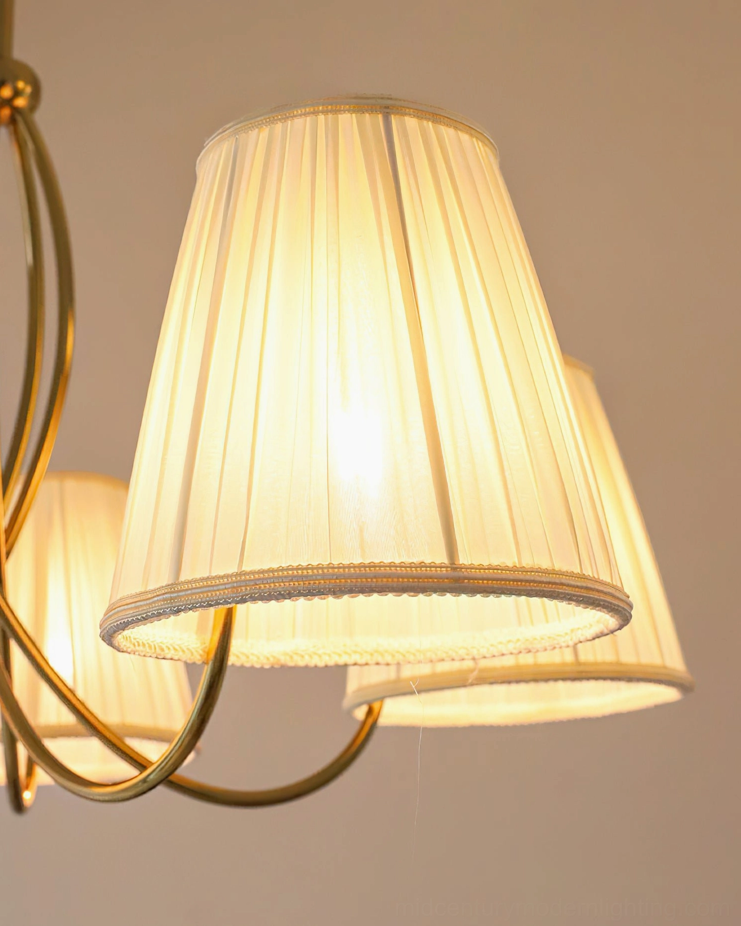 Calistoga mid-century modern chandelier hanging from ceiling, showing elegant suspension chain and proportions