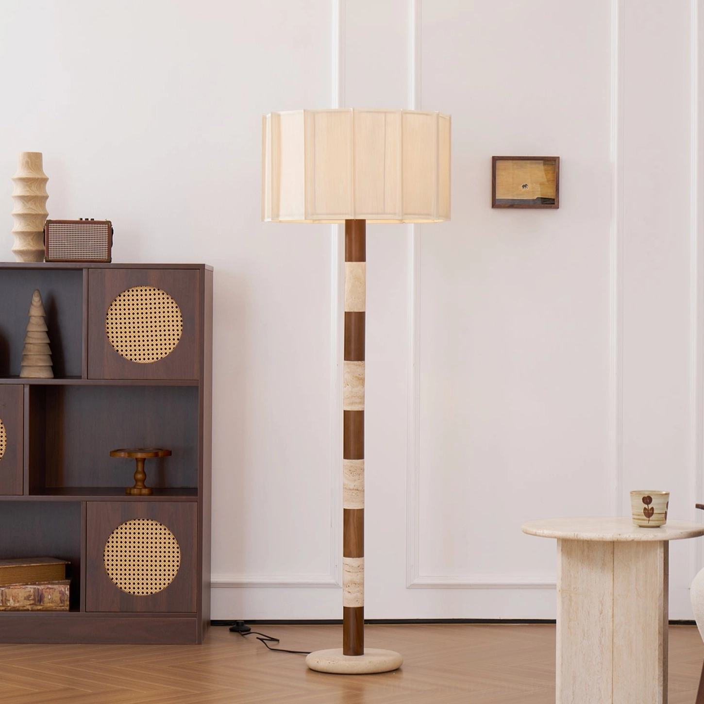 Calypso mid-century modern floor lamp frontal view with matching travertine side table and wall artwork