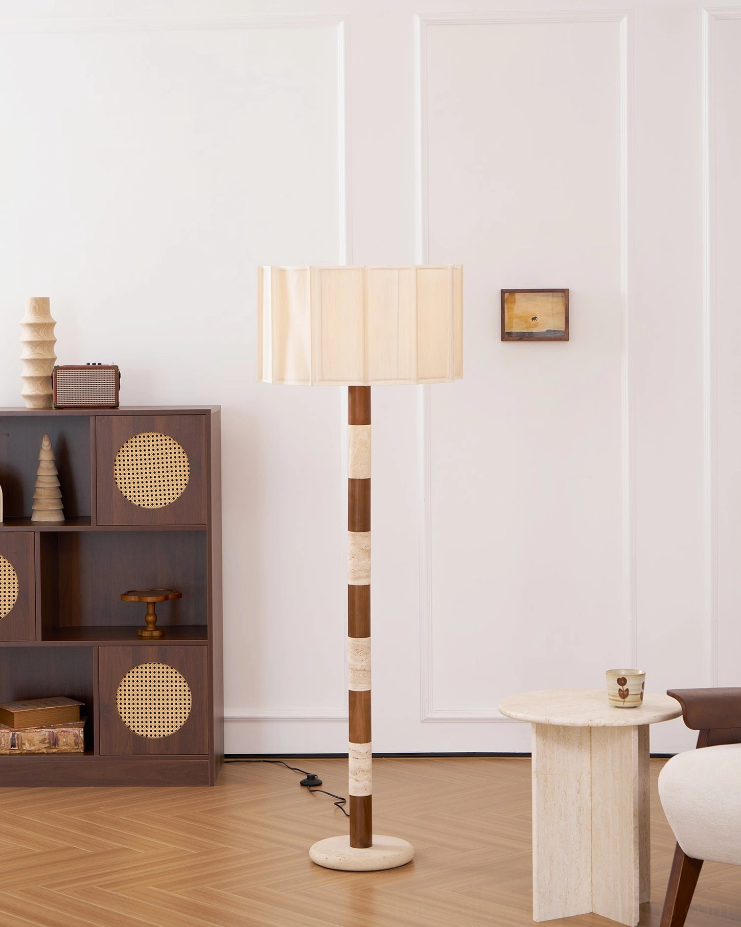 Calypso modern floor lamp full view showing proportions, travertine base, pleated shade, and brass accents