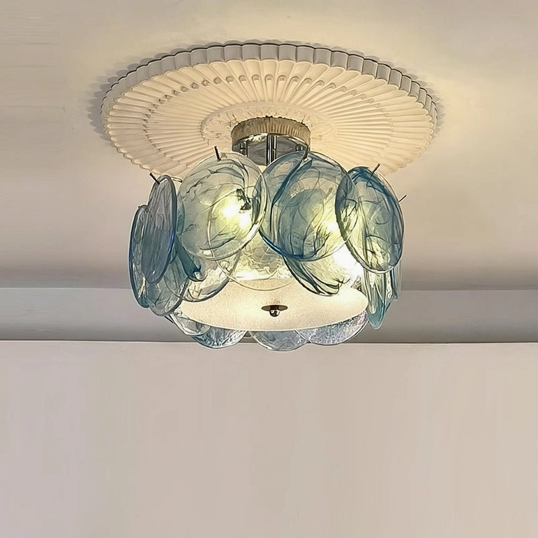 Blue tinted marbled glass petal ceiling light with chrome metal base, overhead minimalist room setting
