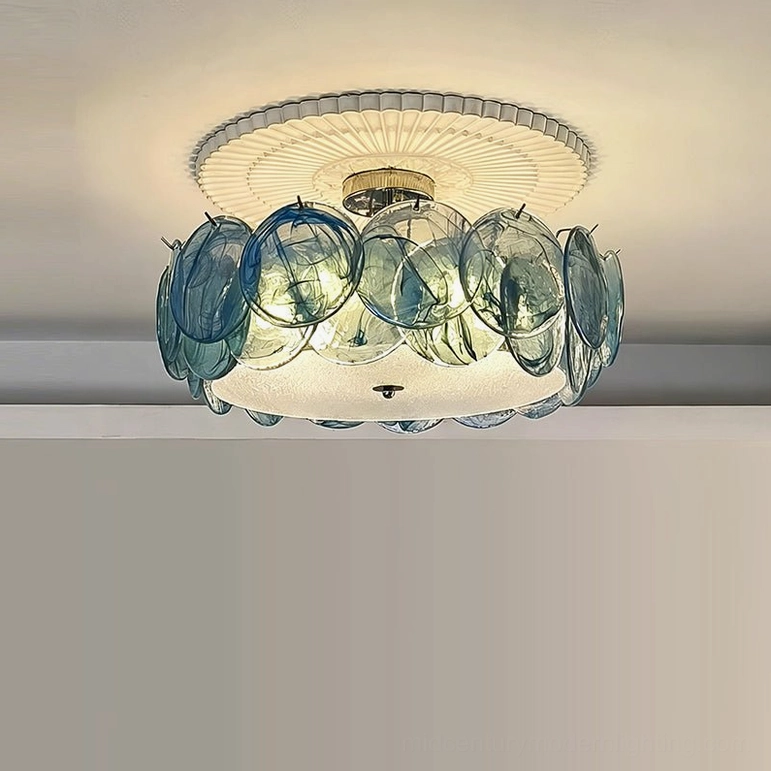 Blue glass flush mount ceiling light in contemporary interior, overhead view showing sculptural petal formation