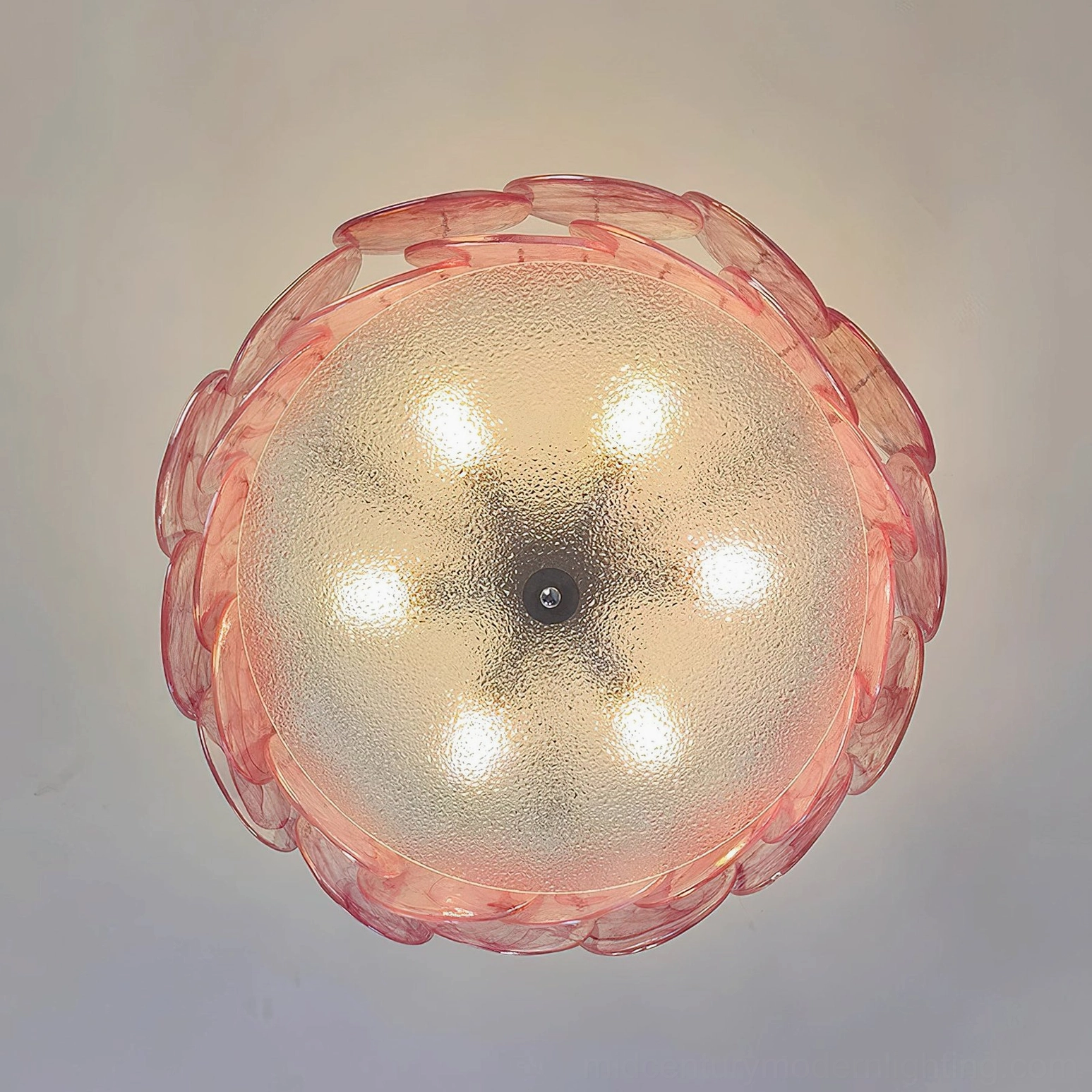 Camden glass petal ceiling light fixture illuminated, showcasing shadowless glare-free downward illumination