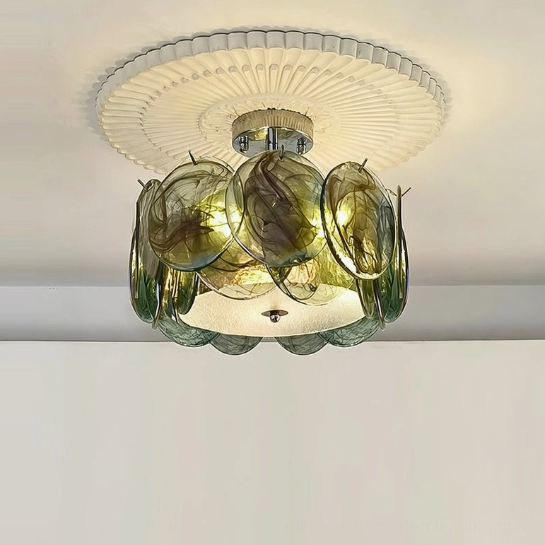 Green sage glass ceiling light fixture with layered petal design, overhead frontal view in minimalist space