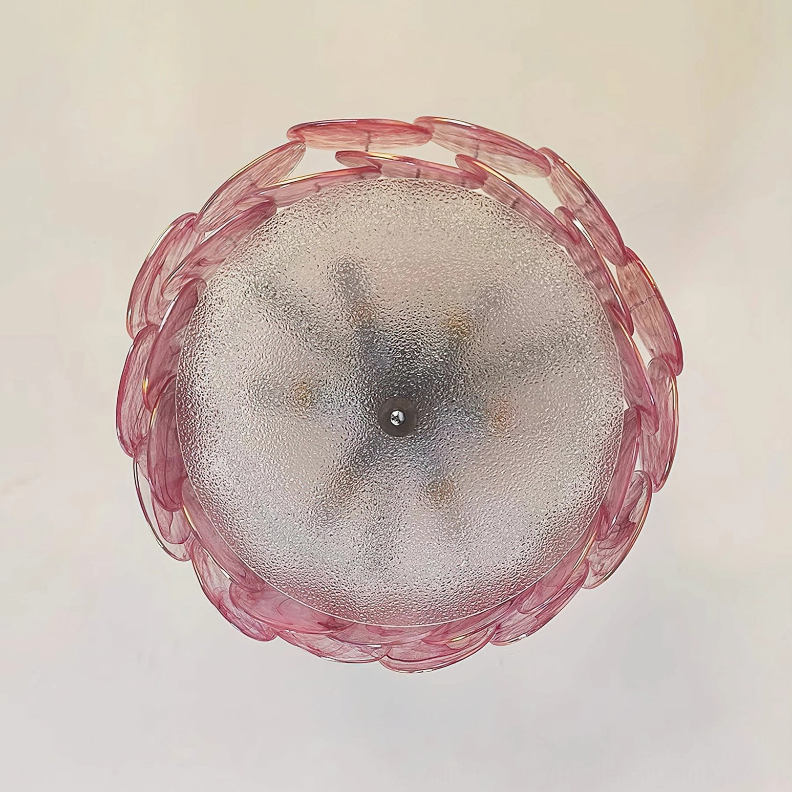 White glass petal ceiling fixture in contemporary minimalist interior, overhead frontal view