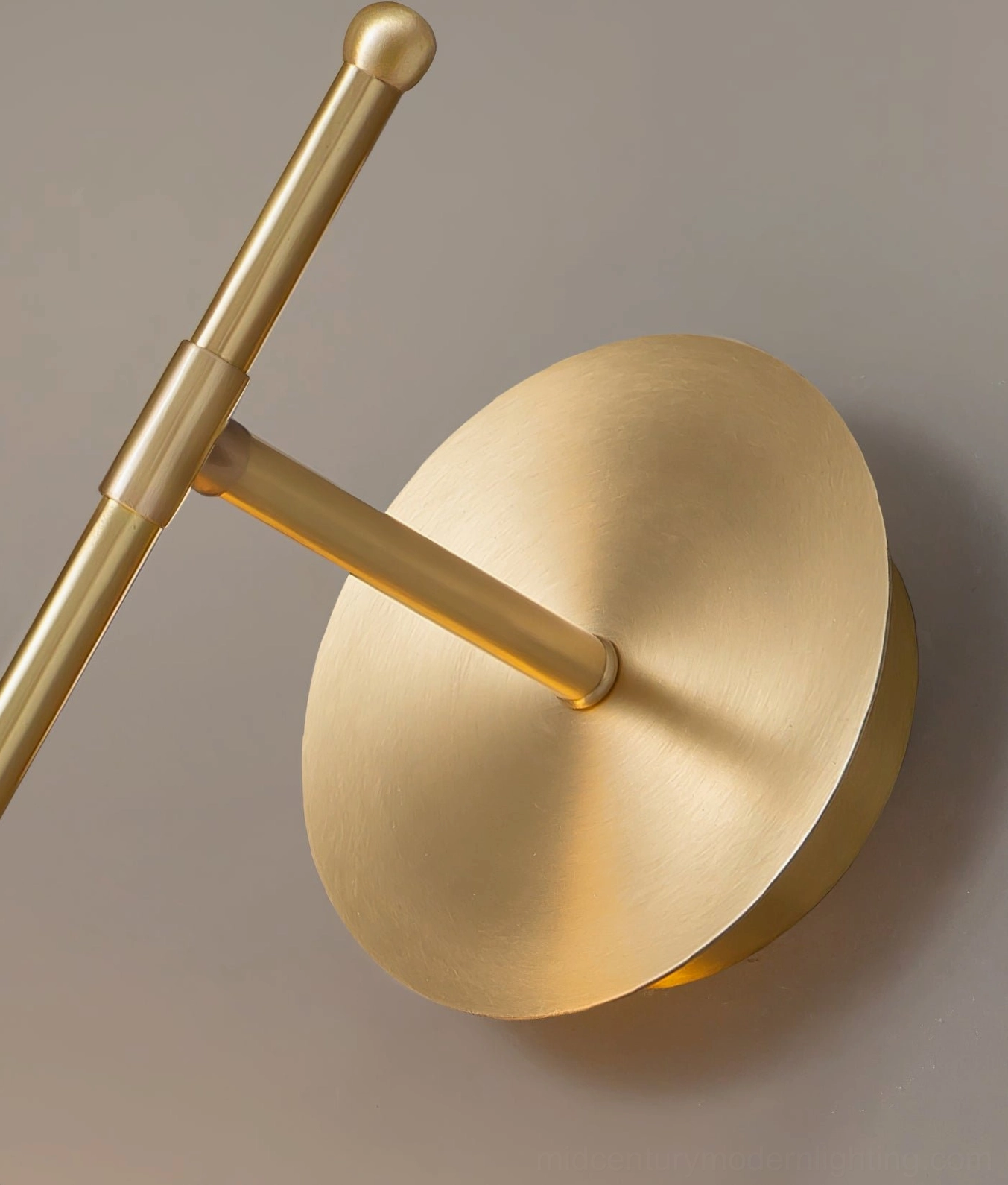 Candied Haws brass wall sconce in modern bedroom above nightstand creating soft reading light