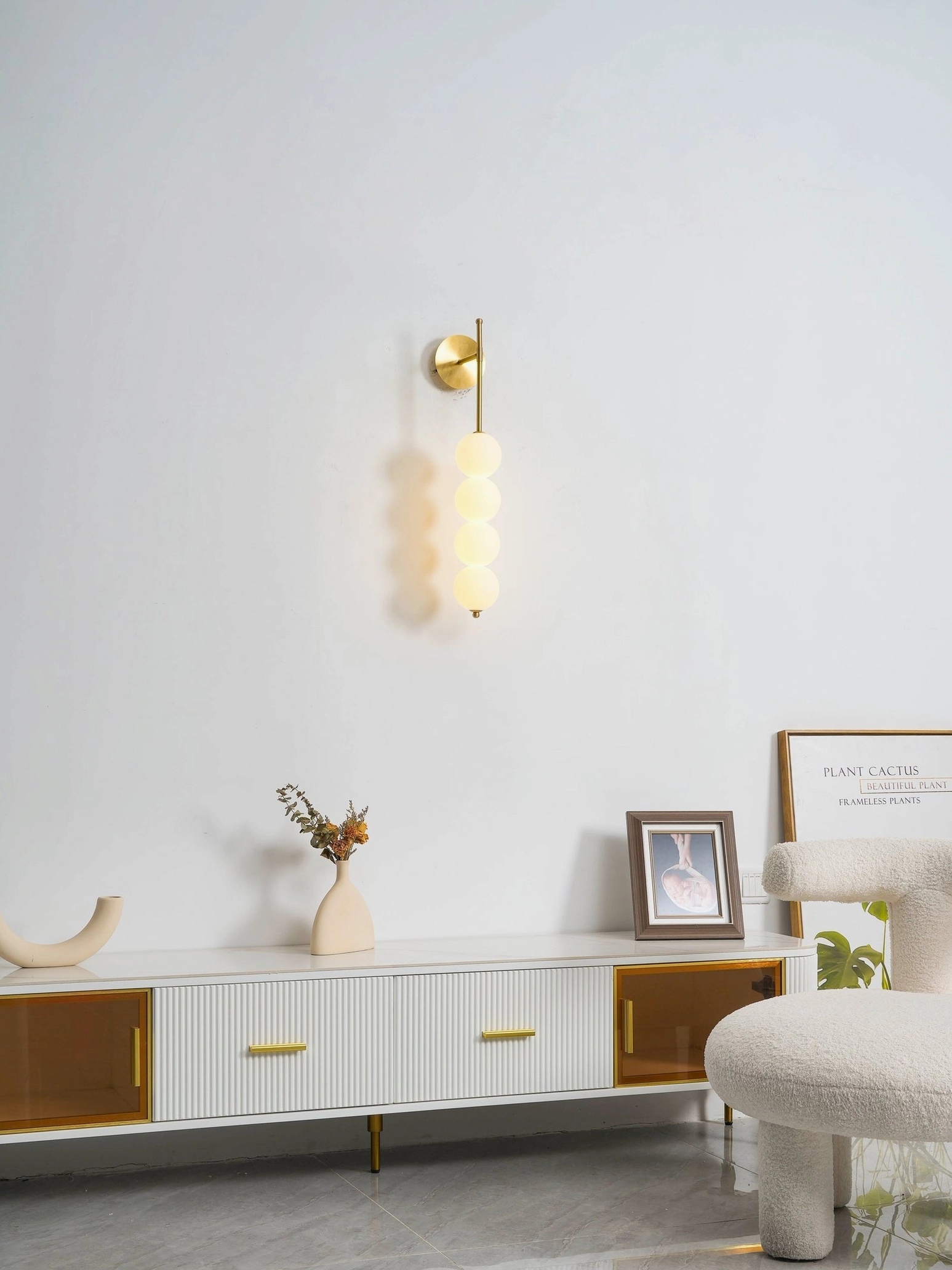 Candied Haws frosted glass globe wall lamp with brass metal frame contemporary design