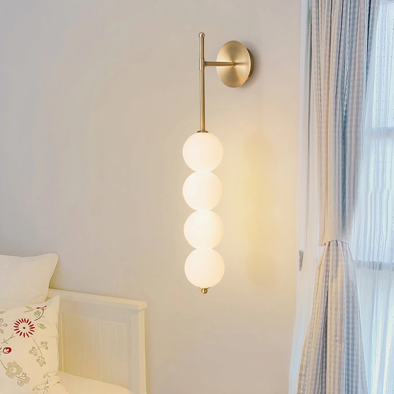 Gold brass Candied Haws wall sconce with frosted glass globes front view product shot