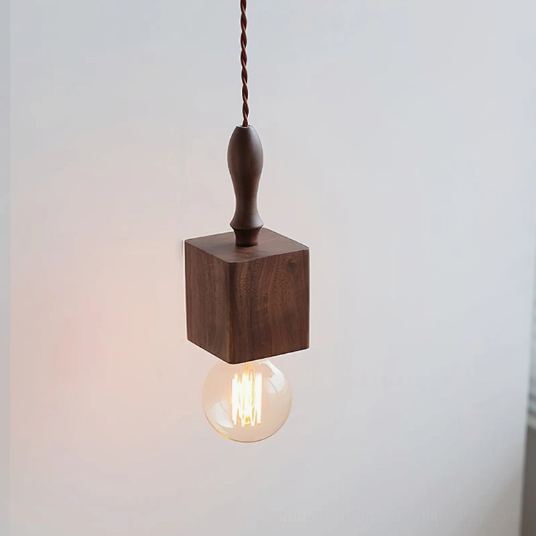 Cano walnut pendant light with sculptural geometric silhouette and warm ambient glow